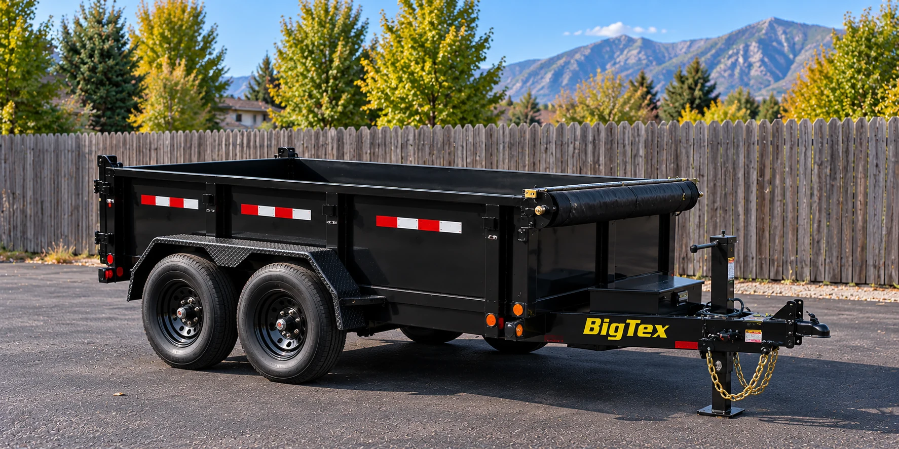 Black 5 by 10 BigTex tandem-axle dump trailer
