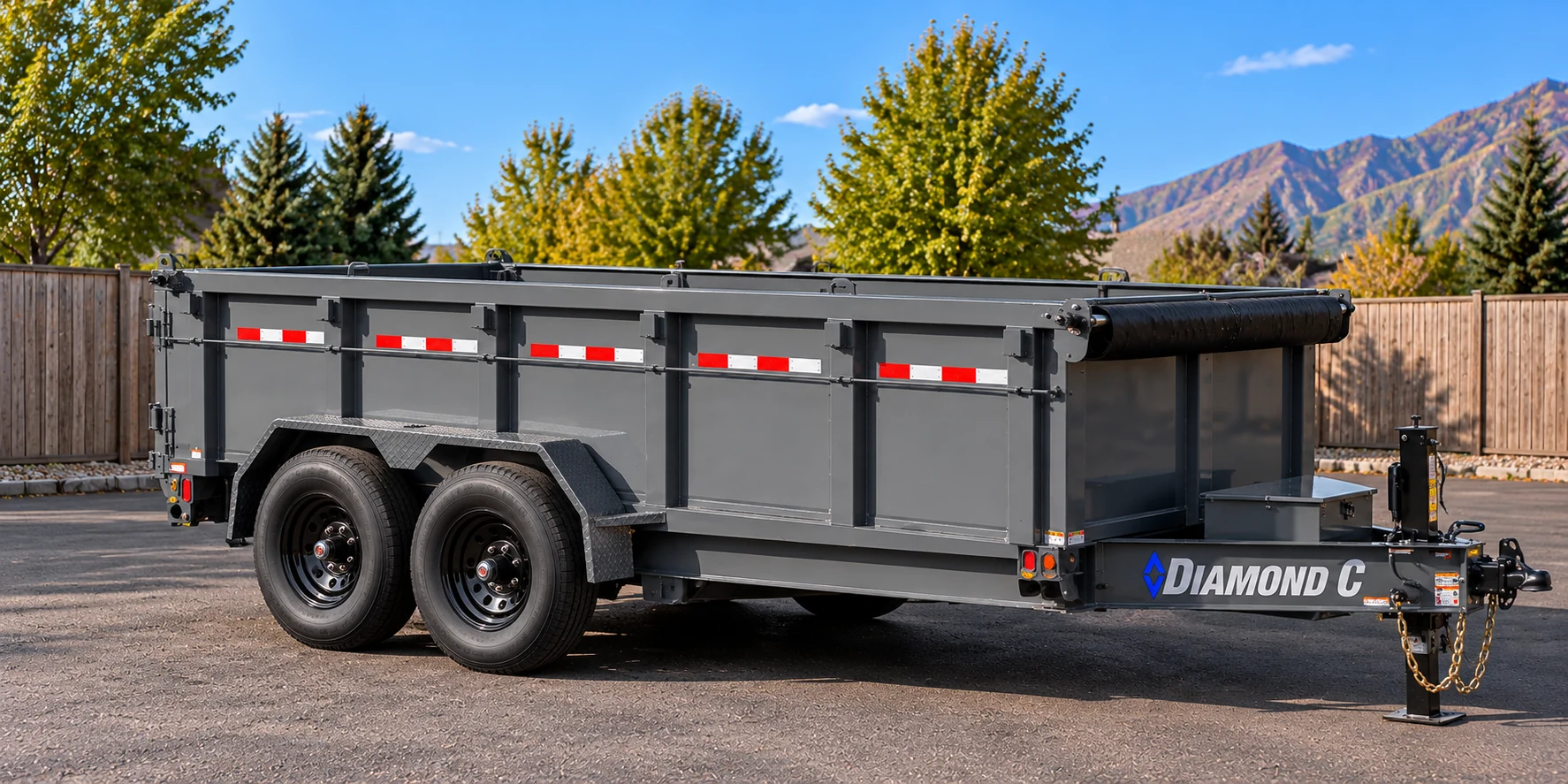Gray 7 by 14 Diamond C tandem-axle dump trailer