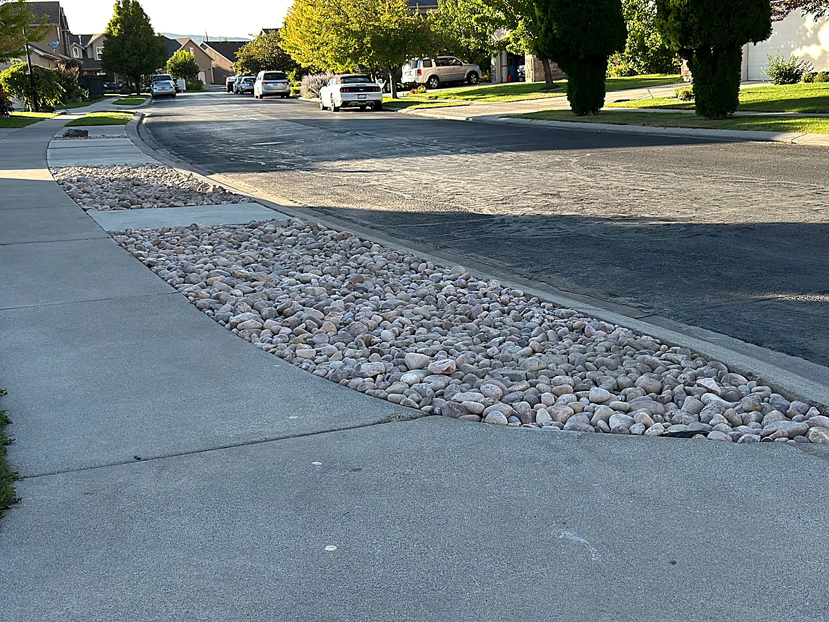 Completed Cedar Hills low-maintenance rock curb strip project